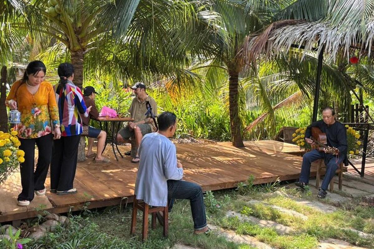 a group of people sitting on a wooden deck