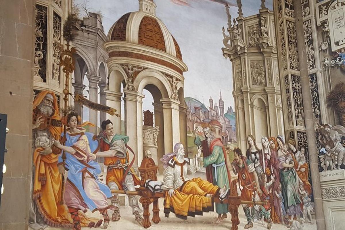 a mural on the wall of a building with a painting