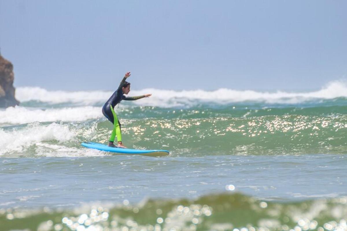 a person riding a wave on a surfboard in the ocean
