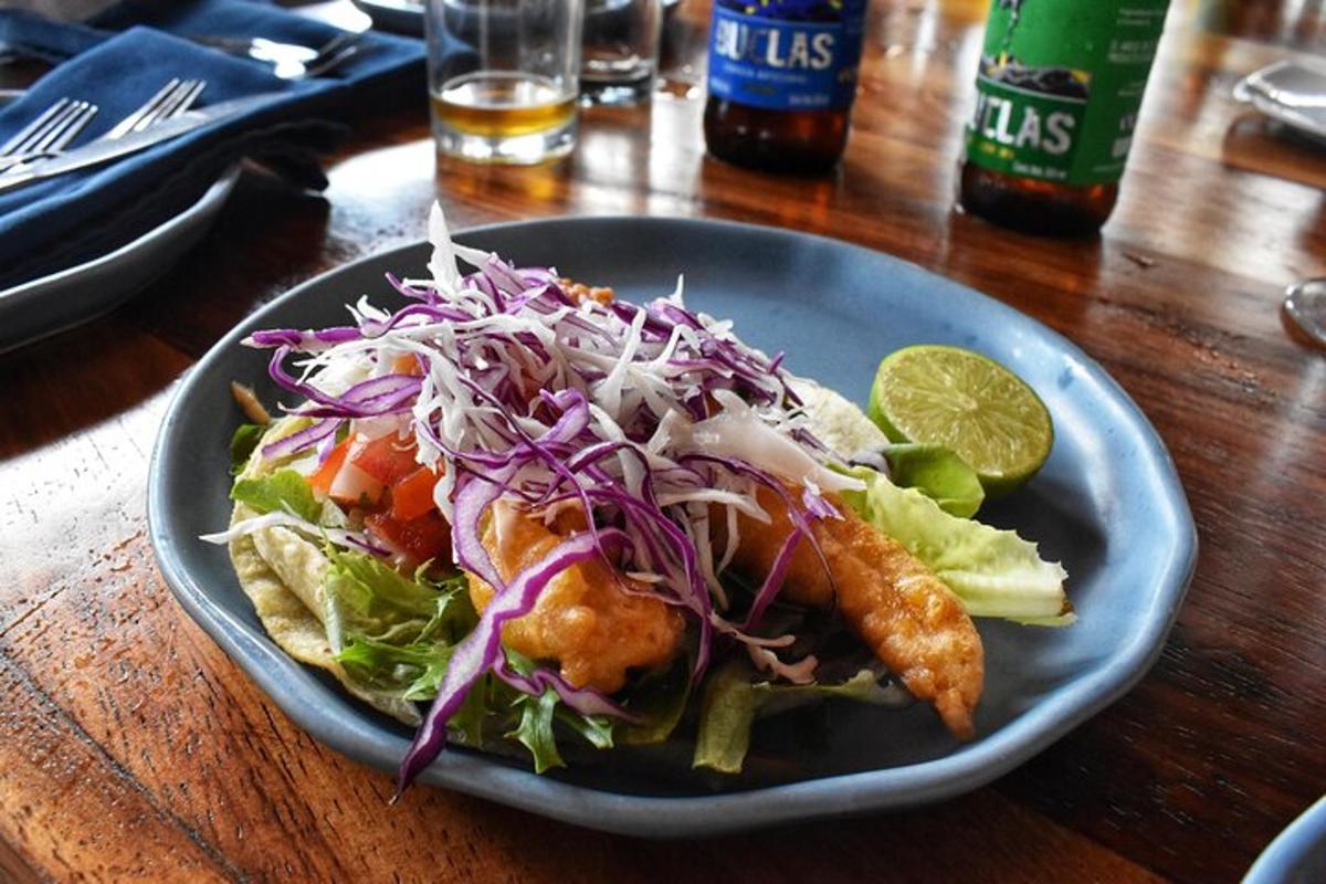 a plate of food on a table with a salad