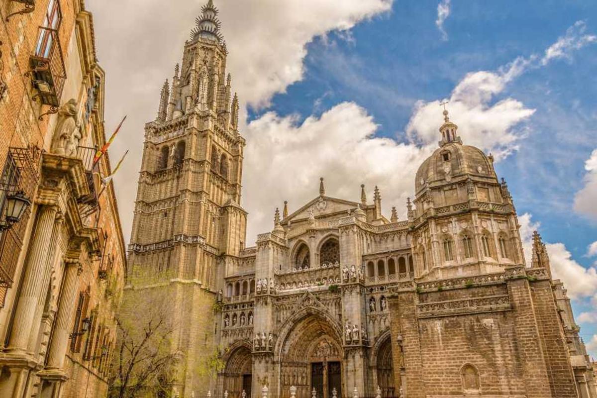 an old building with a tower and a cathedral