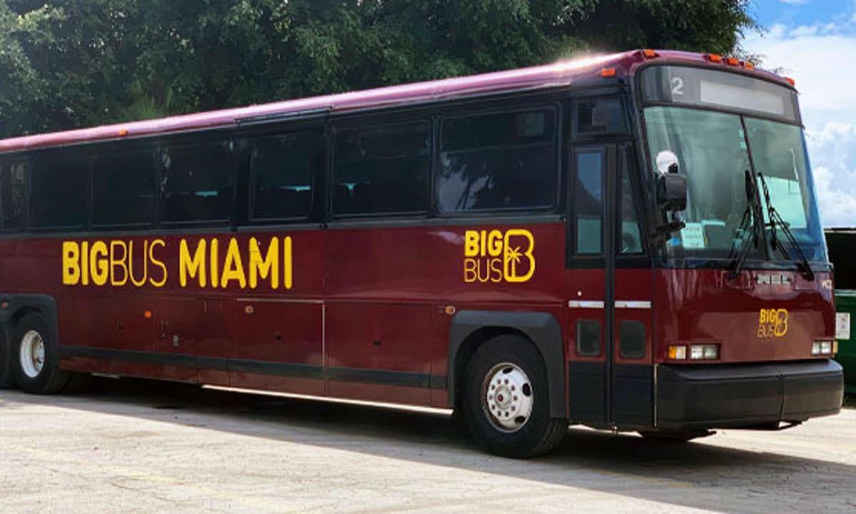 a red bus with a big bus man written on it