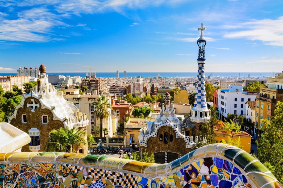 a view of a city with a cross on a pole