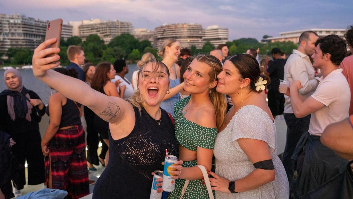 a group of women posing for a picture at a party