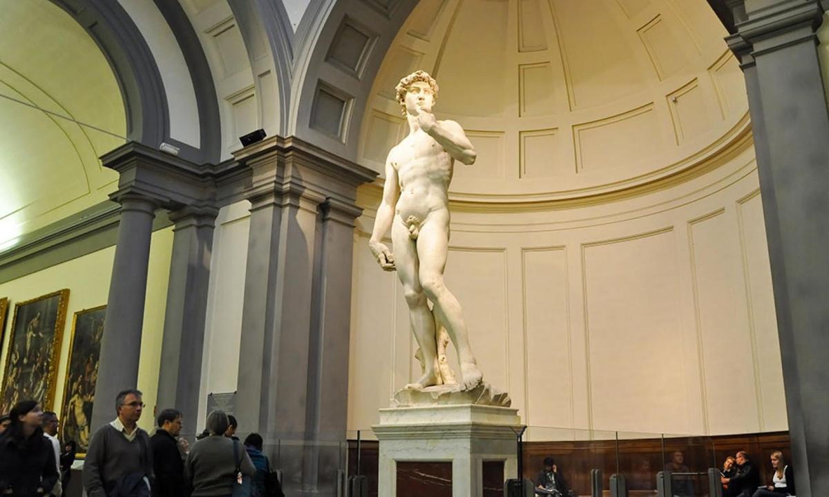 a statue of a man in a museum