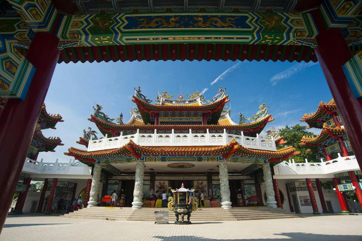 a large building with a person standing in front of it