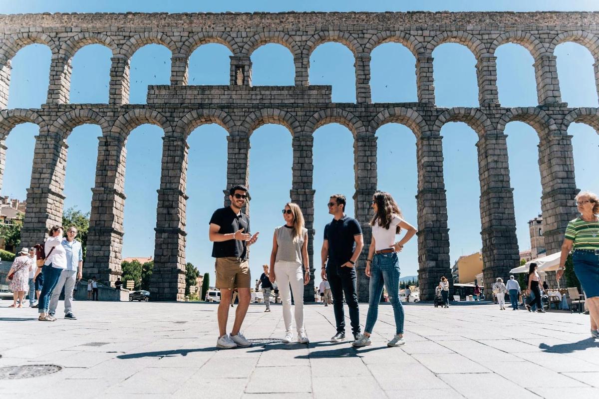 a group of people standing in front of a building