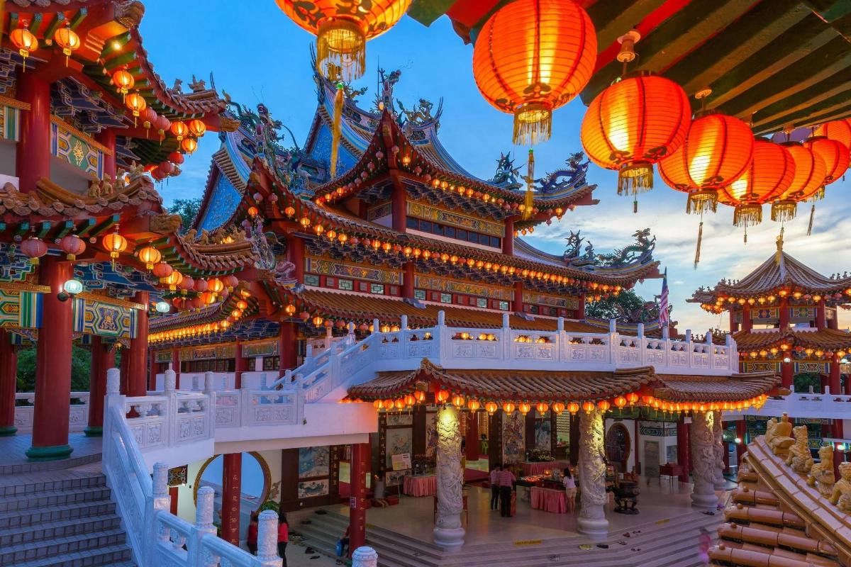 a building with orange lanterns in front of it