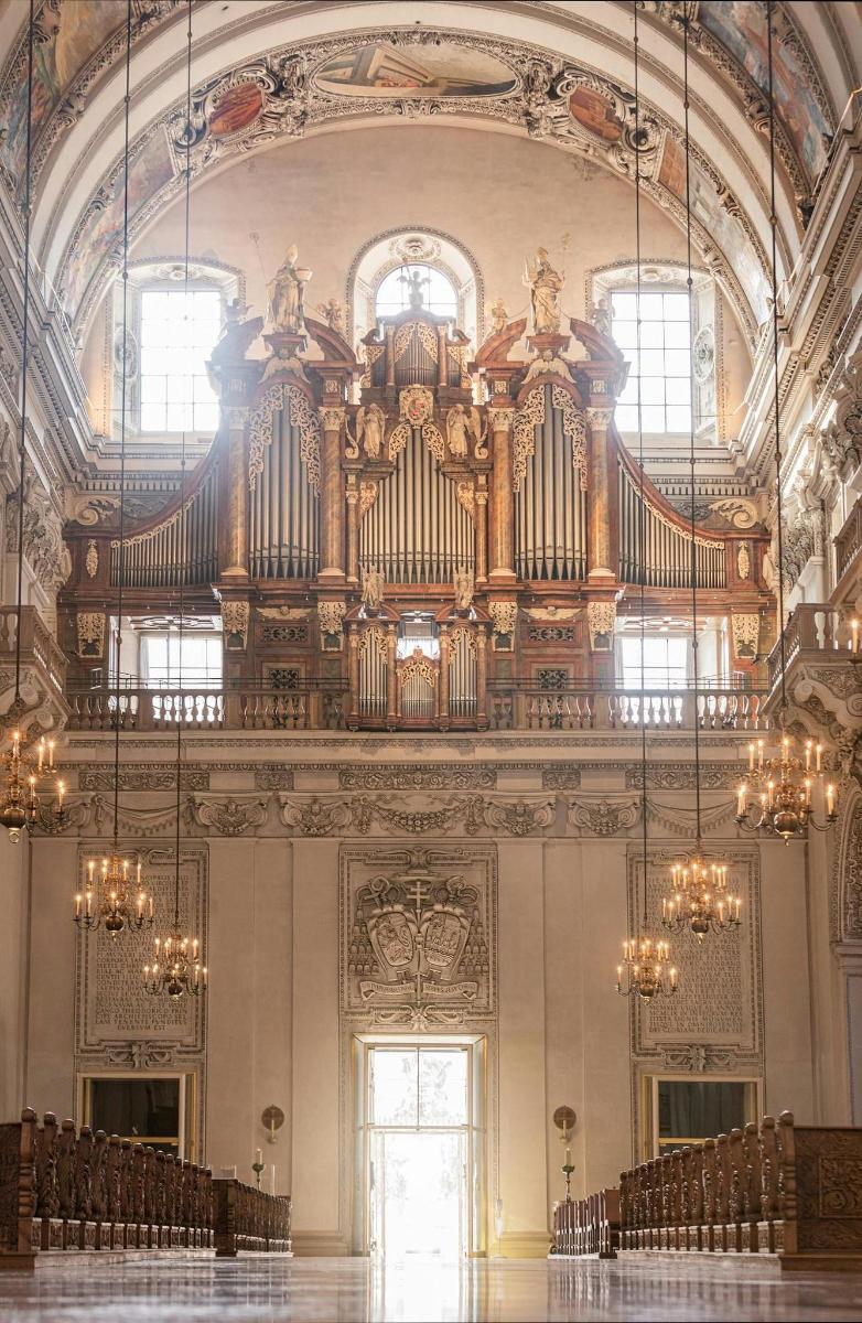 a large organ in a large room with chairs