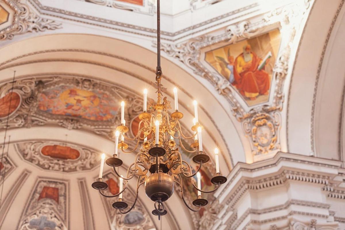 a chandelier hanging from the ceiling in a building