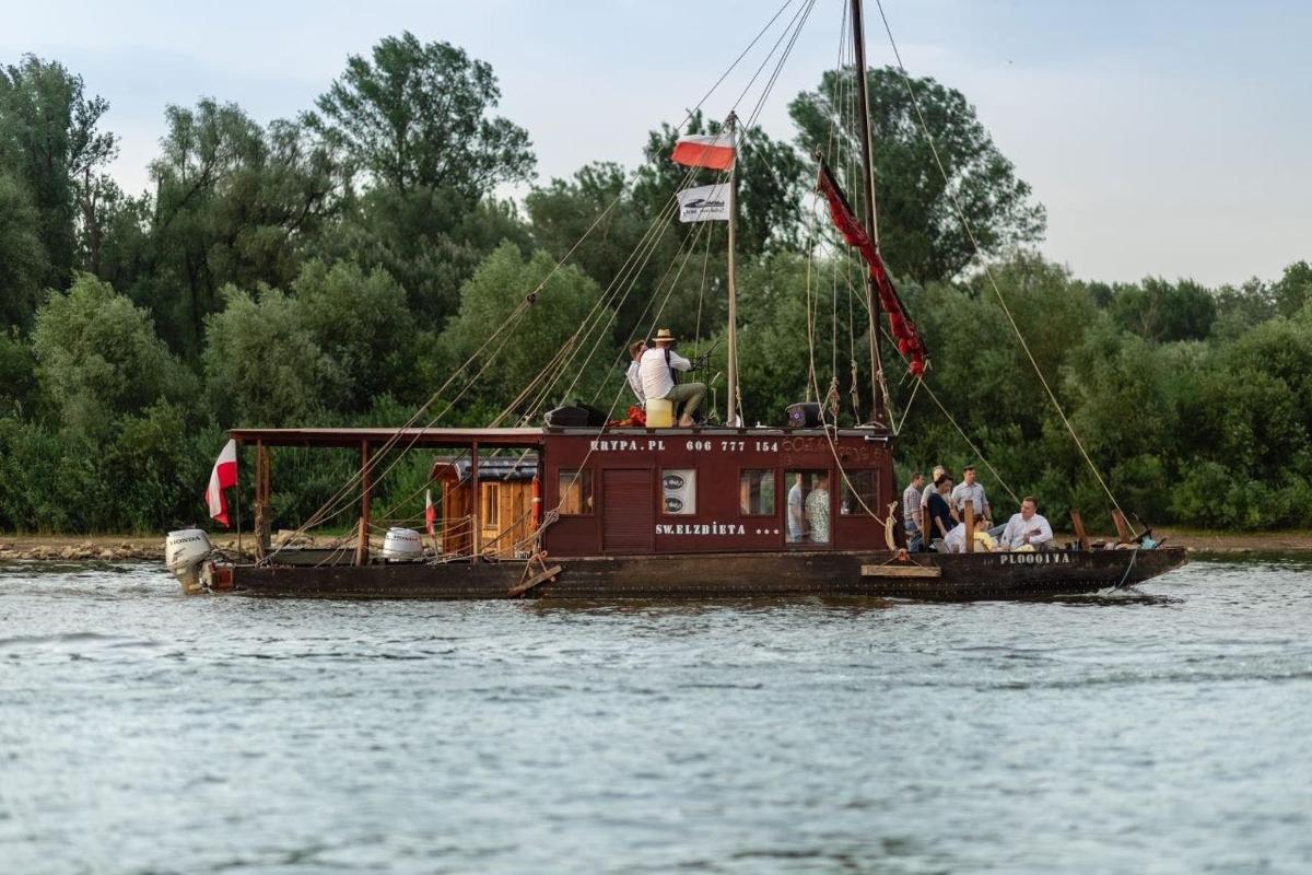 a group of people on a boat in the water