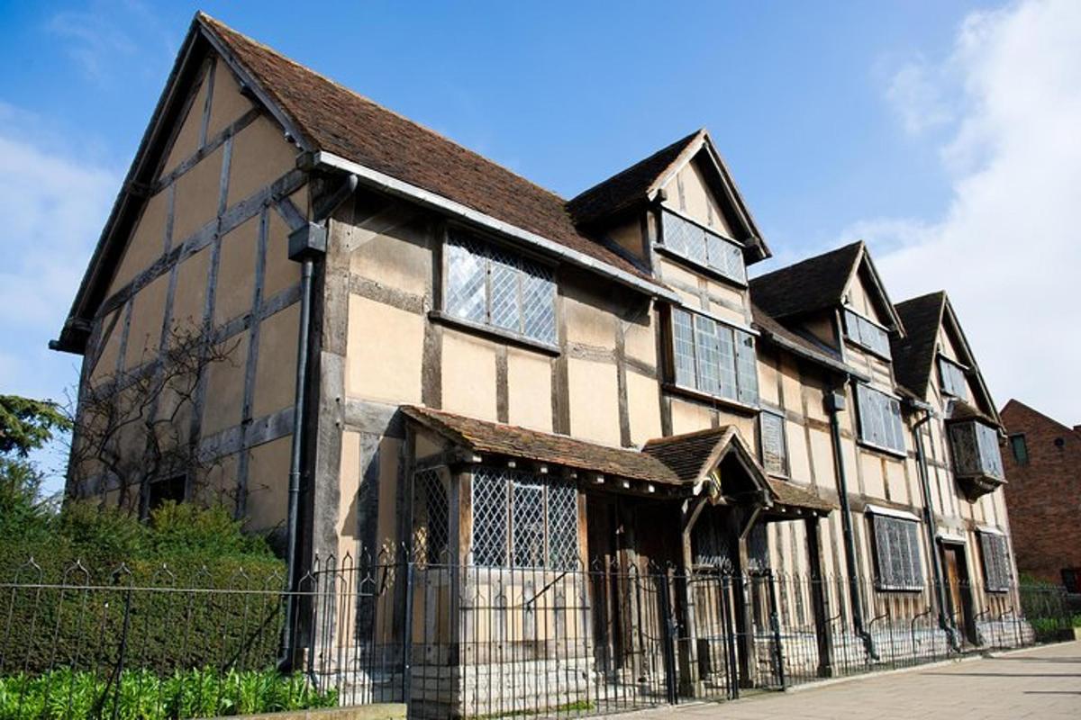an old building with a fence in front of it