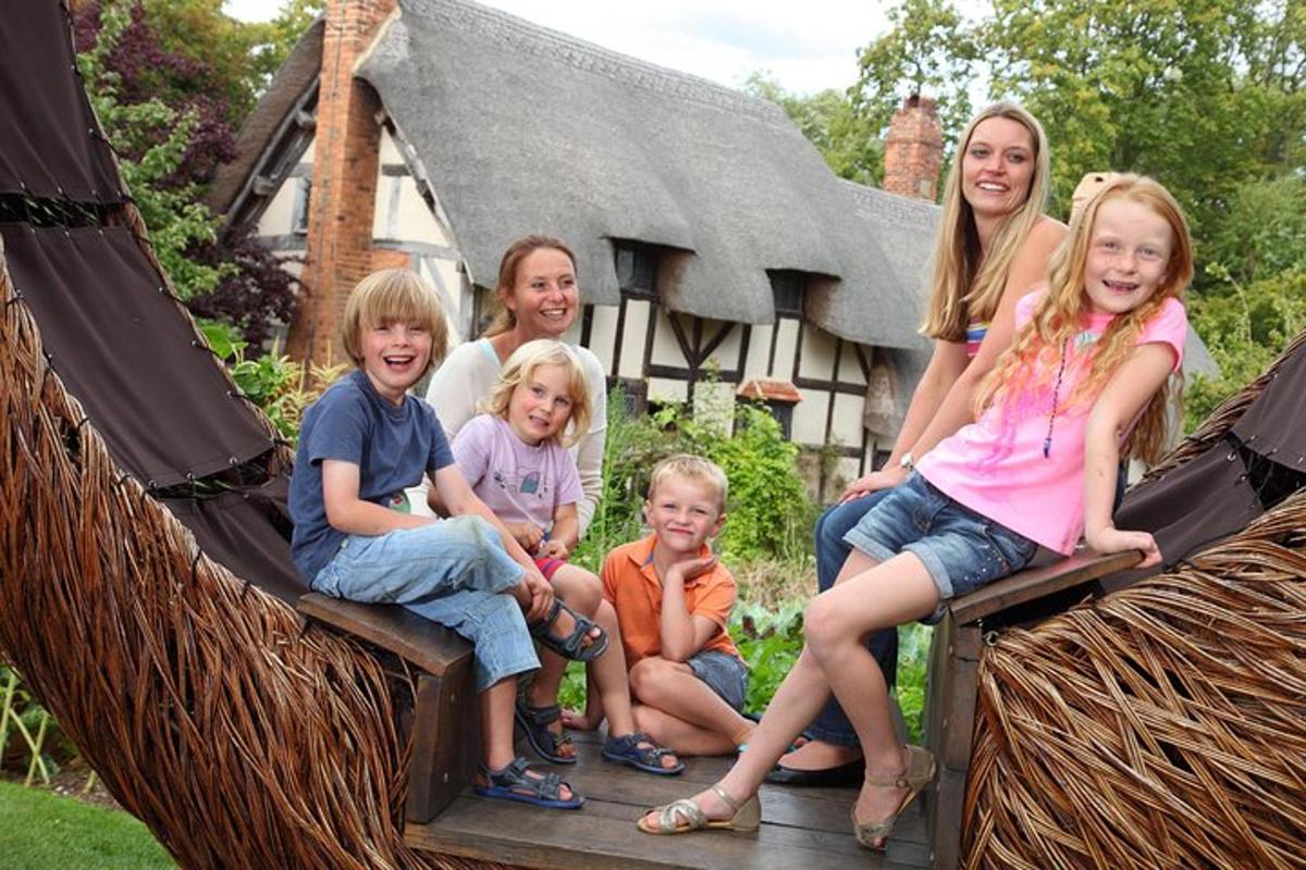 a group of children sitting on a swing