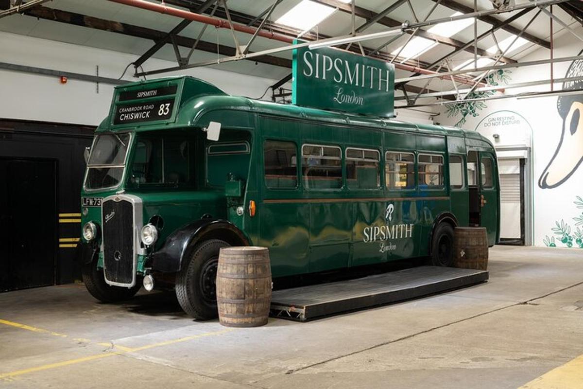 a green bus is parked in a garage