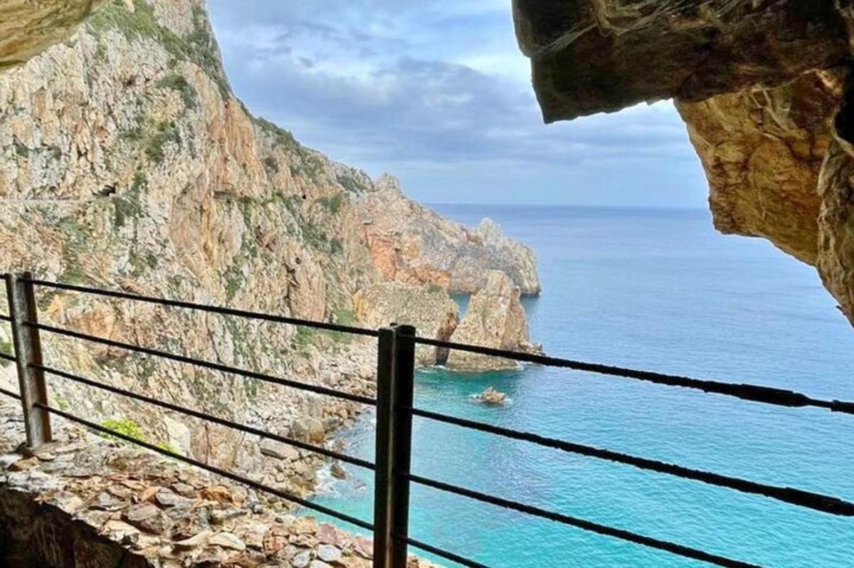 a view of the ocean from a rock cliff