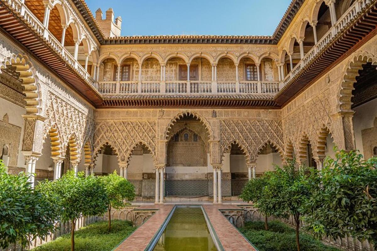 a courtyard of a building with a fountain in it