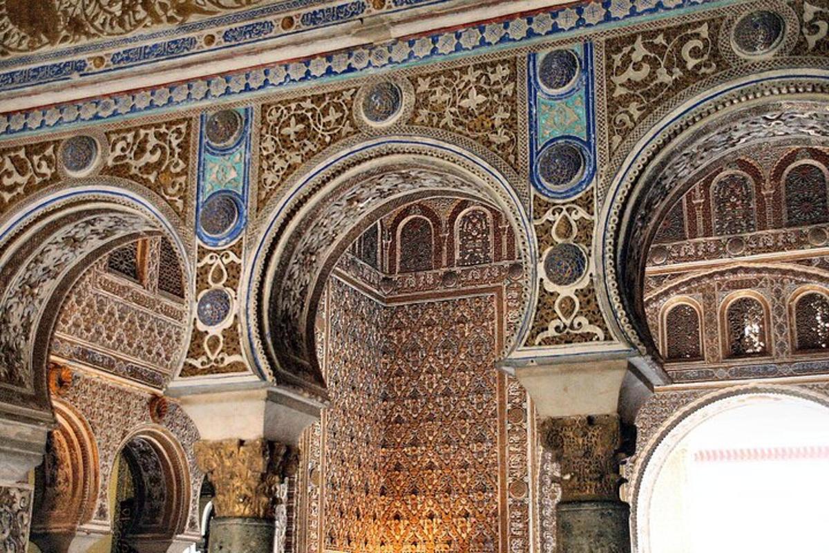 a room with a wall covered in mosaics