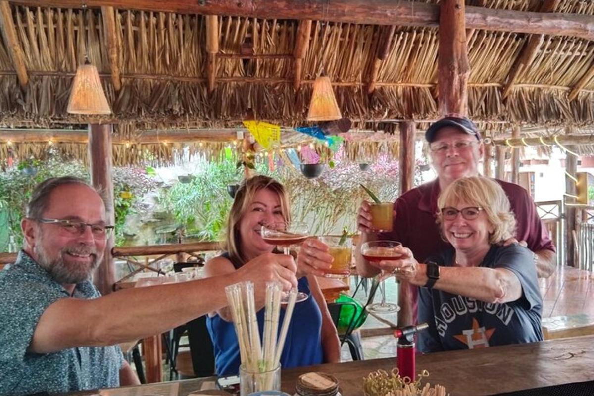 a group of people sitting at a table with drinks