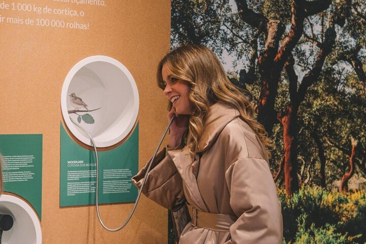 a woman talking on a phone next to a wall