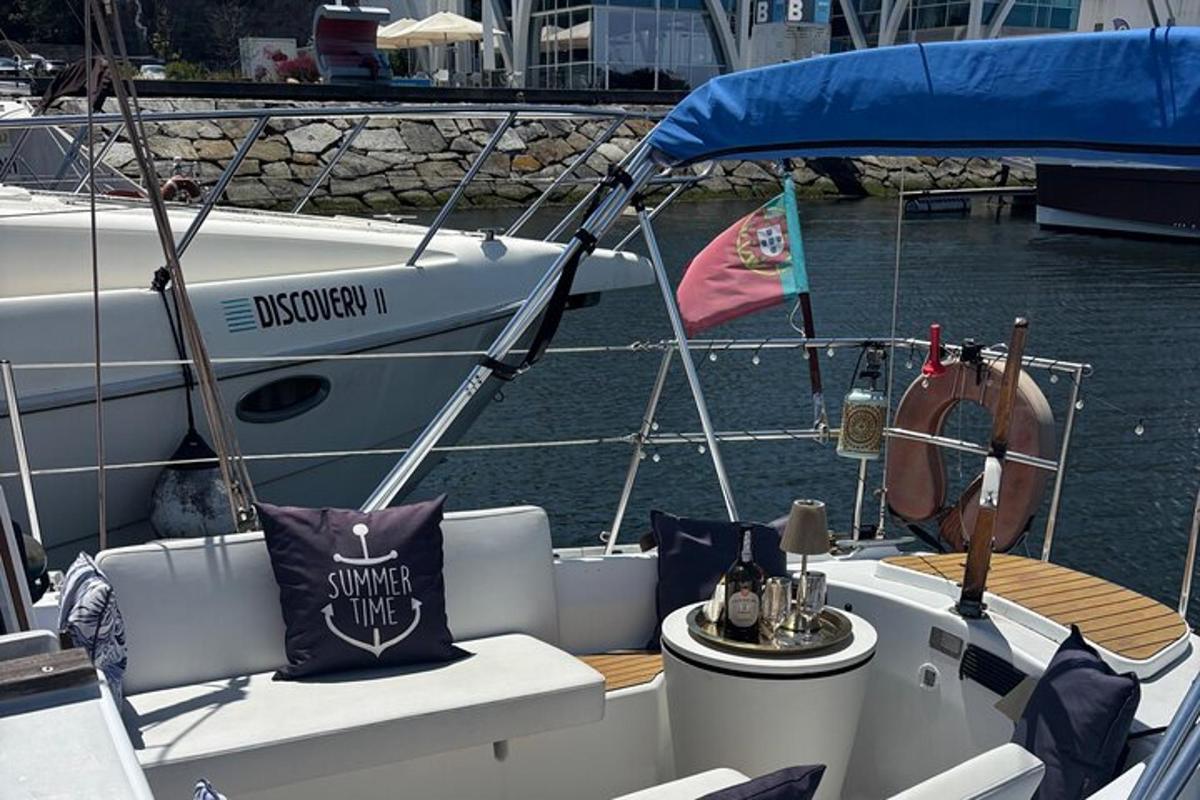 a boat sitting in the water with a flag on it