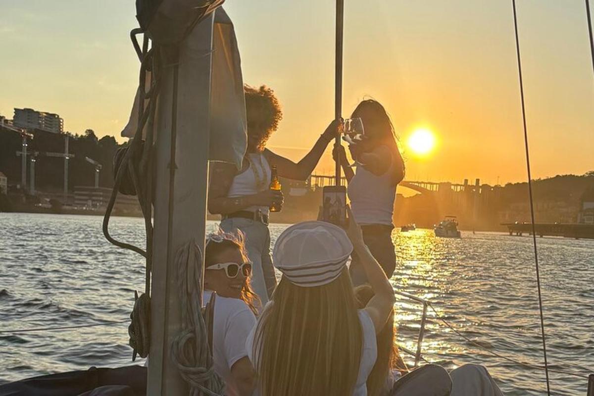 a group of people on a boat at sunset
