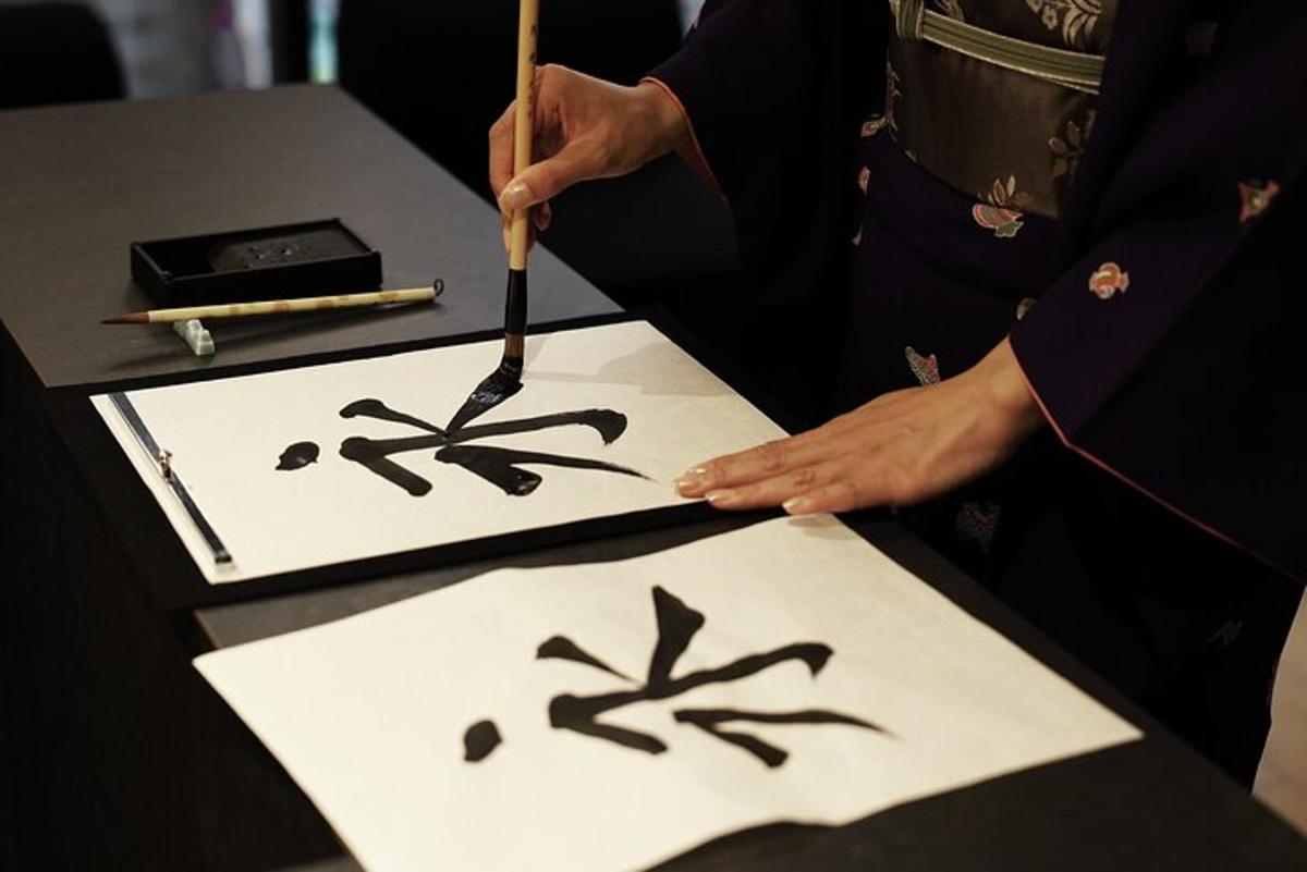 a person cutting a piece of paper with a knife
