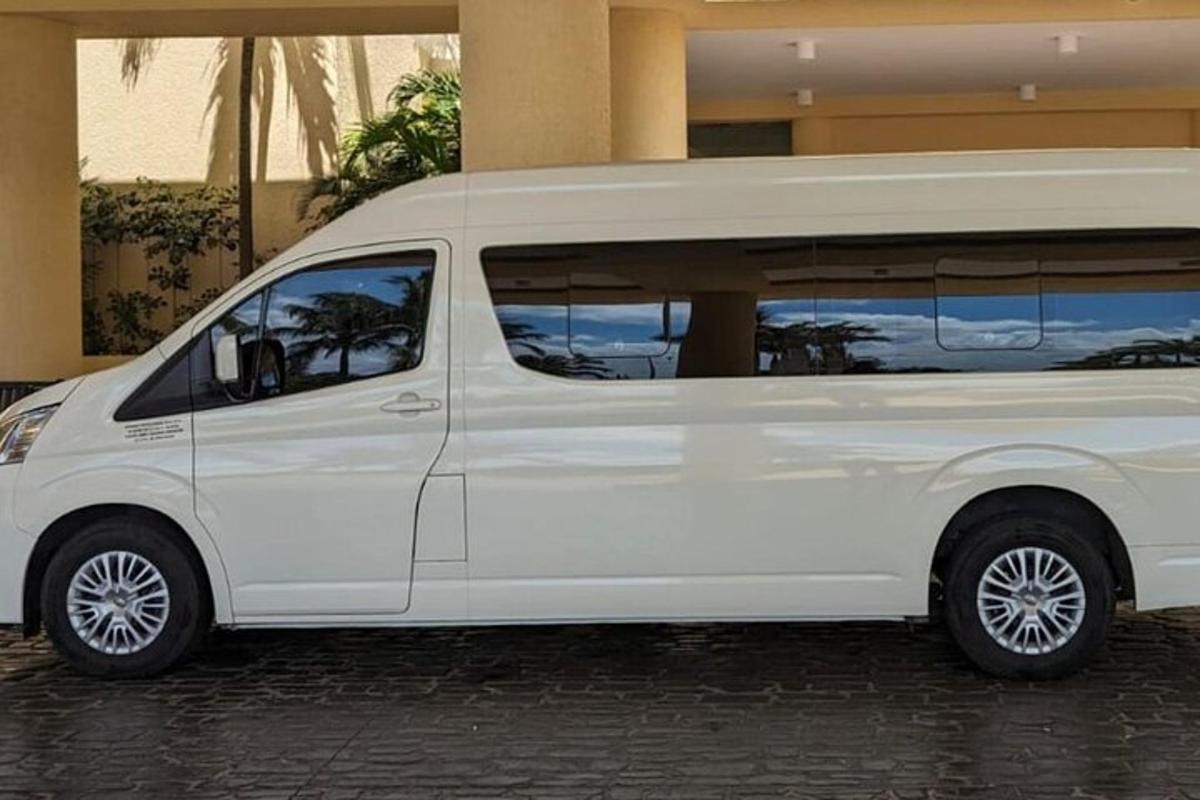 a white van parked in front of a building