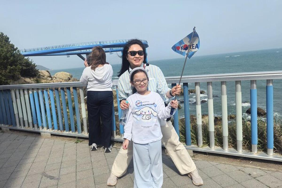 a woman and a girl holding a flag
