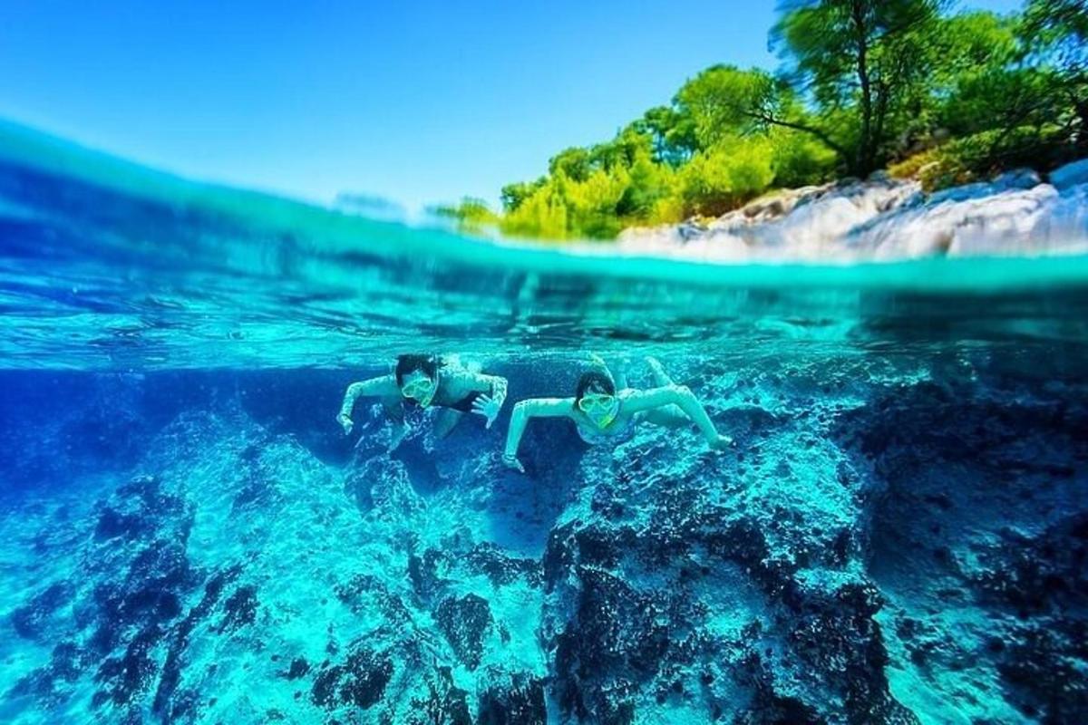two people are swimming in the water