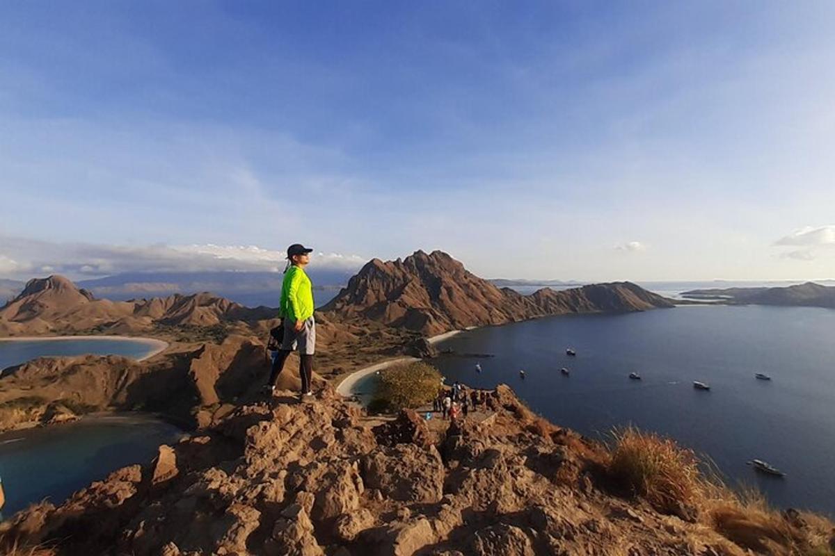 a man standing on top of a mountain