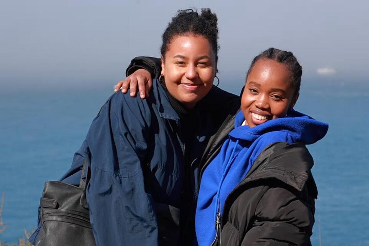 a woman and a girl posing for a picture