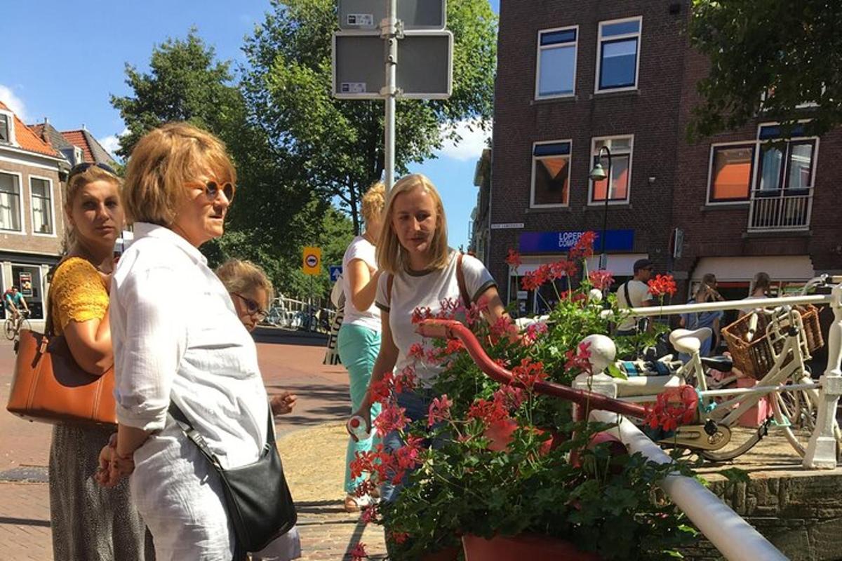 a group of women standing next to a bike with flowers
