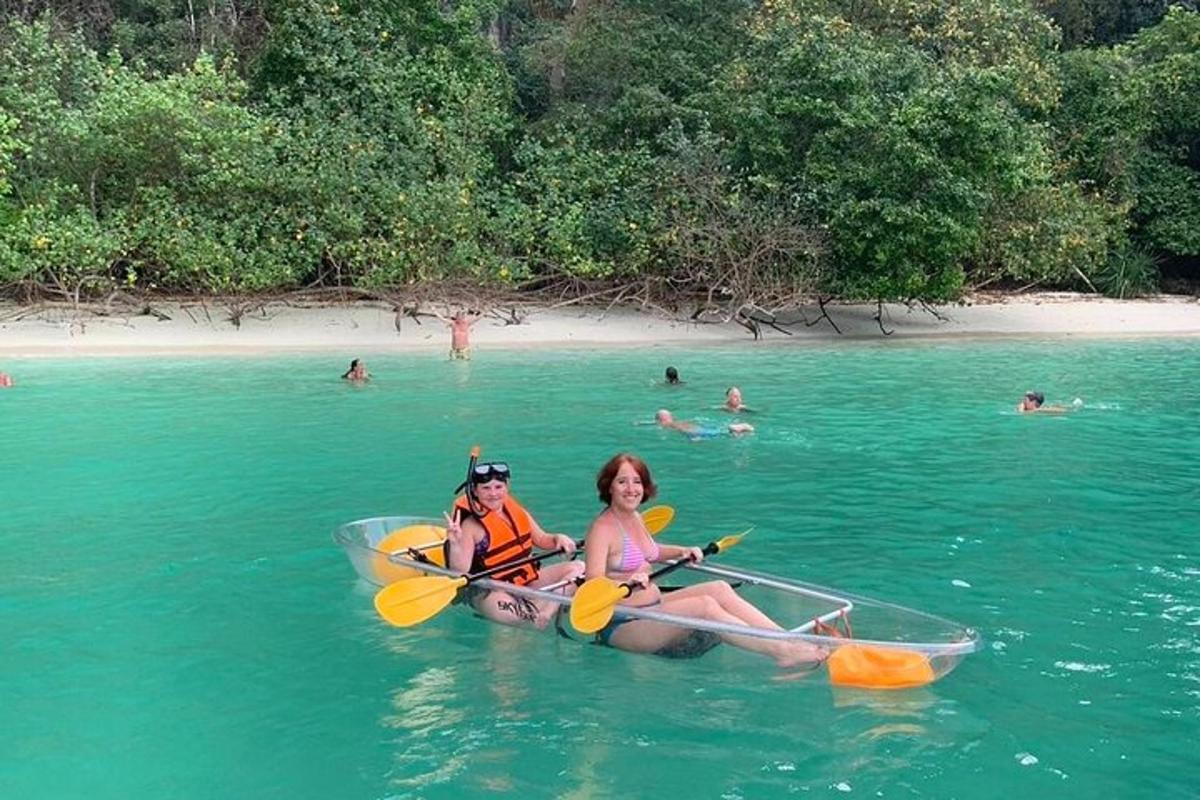 two women are riding in kayaks in the water