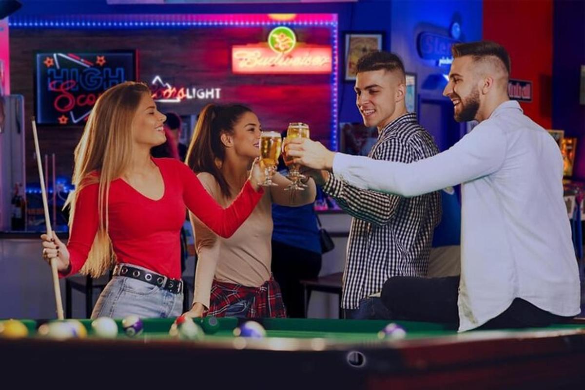 a group of people playing pool in a casino