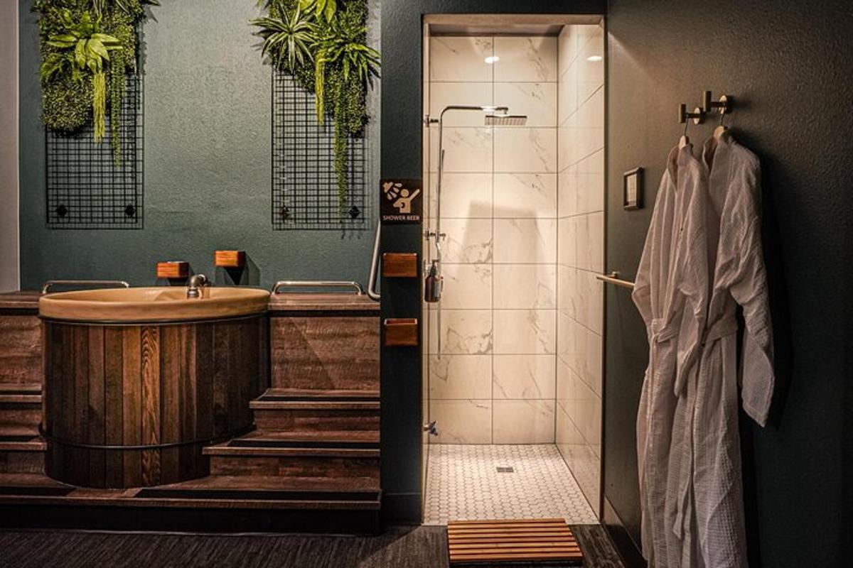 a bathroom with a shower and a sink and a tub