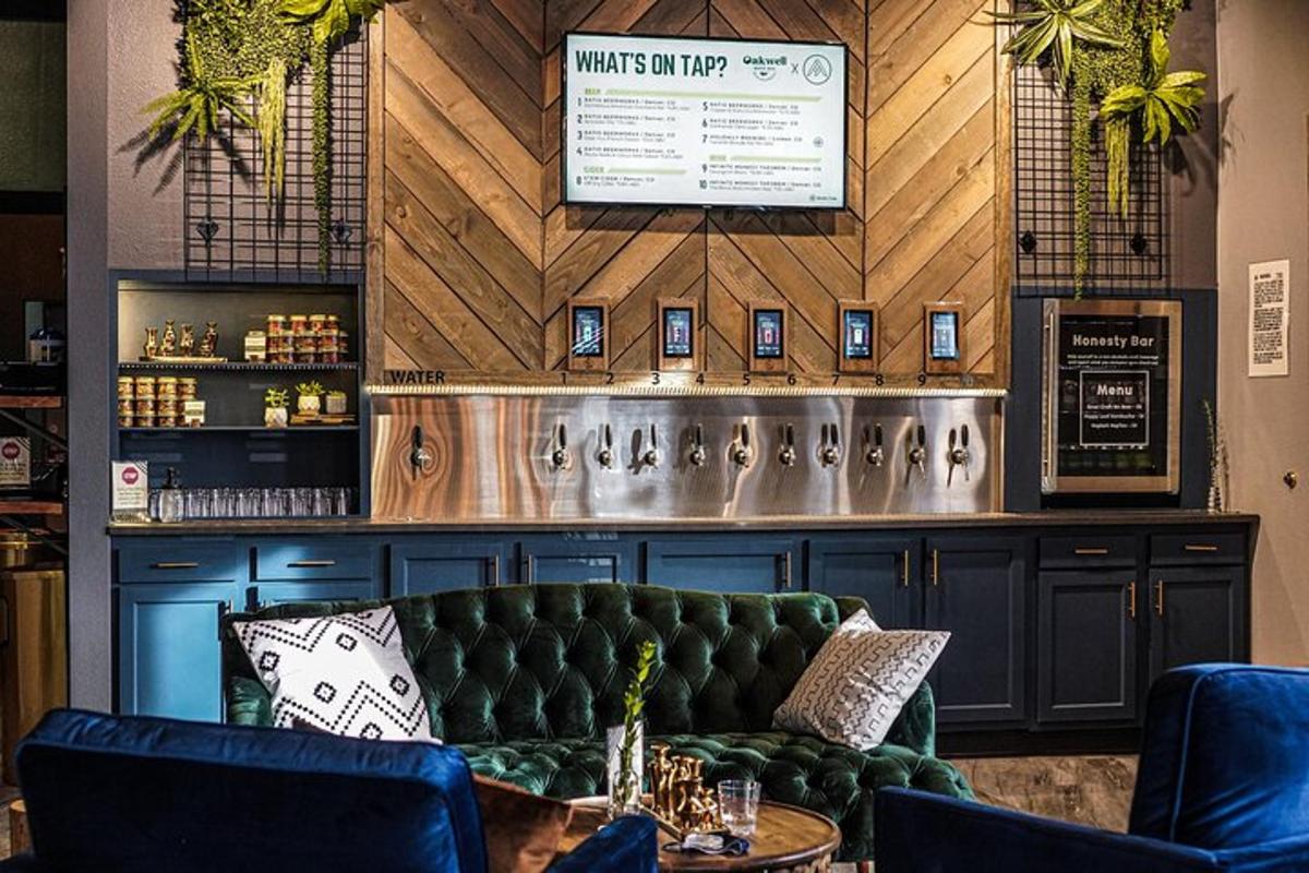 a bar with a green couch in a room