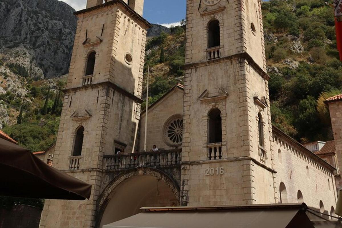 an old building with two towers and a bridge
