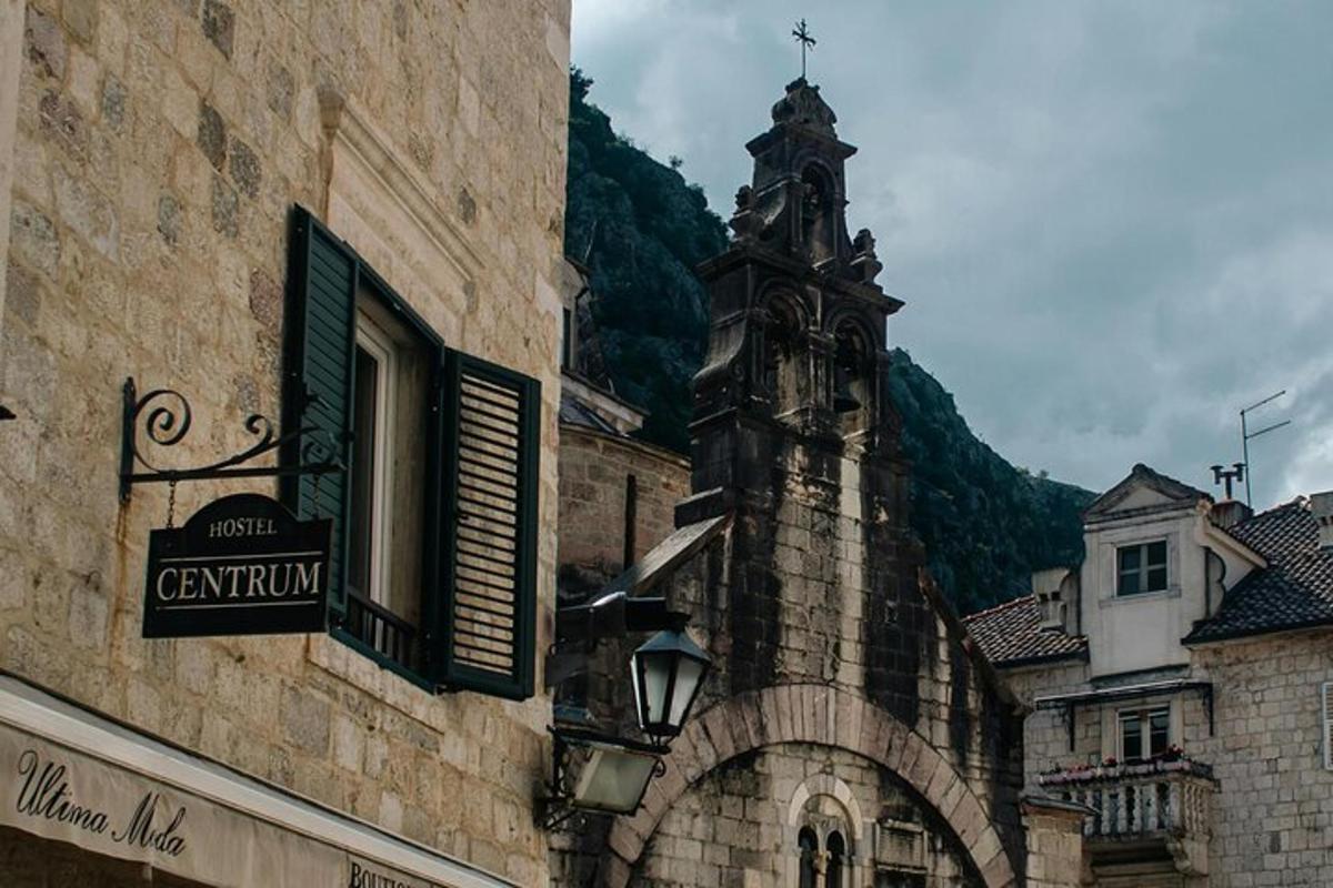a building with a clock tower and a street sign on it