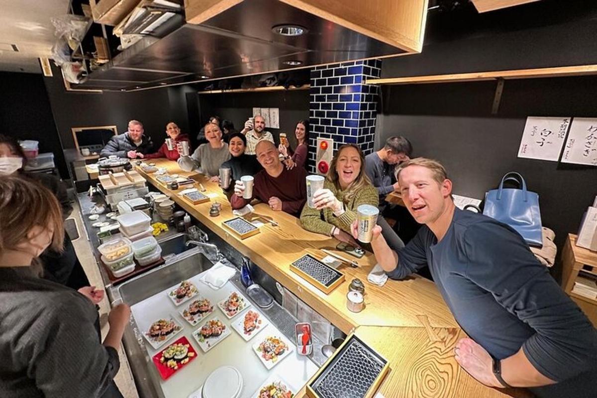 a group of people sitting at a table in a restaurant