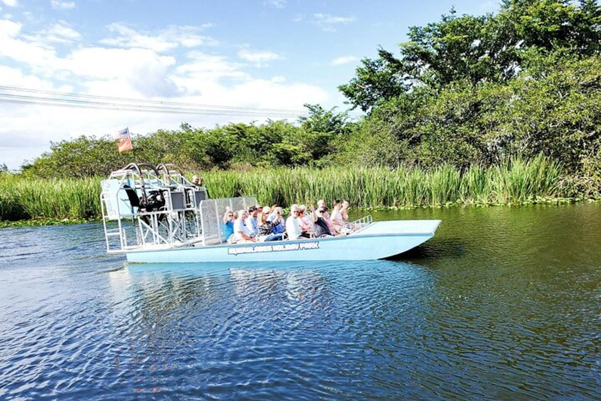 a group of people in a boat on the water