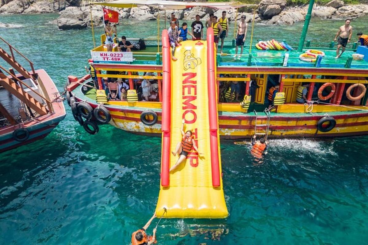 a large boat in the water with a inflatable boat
