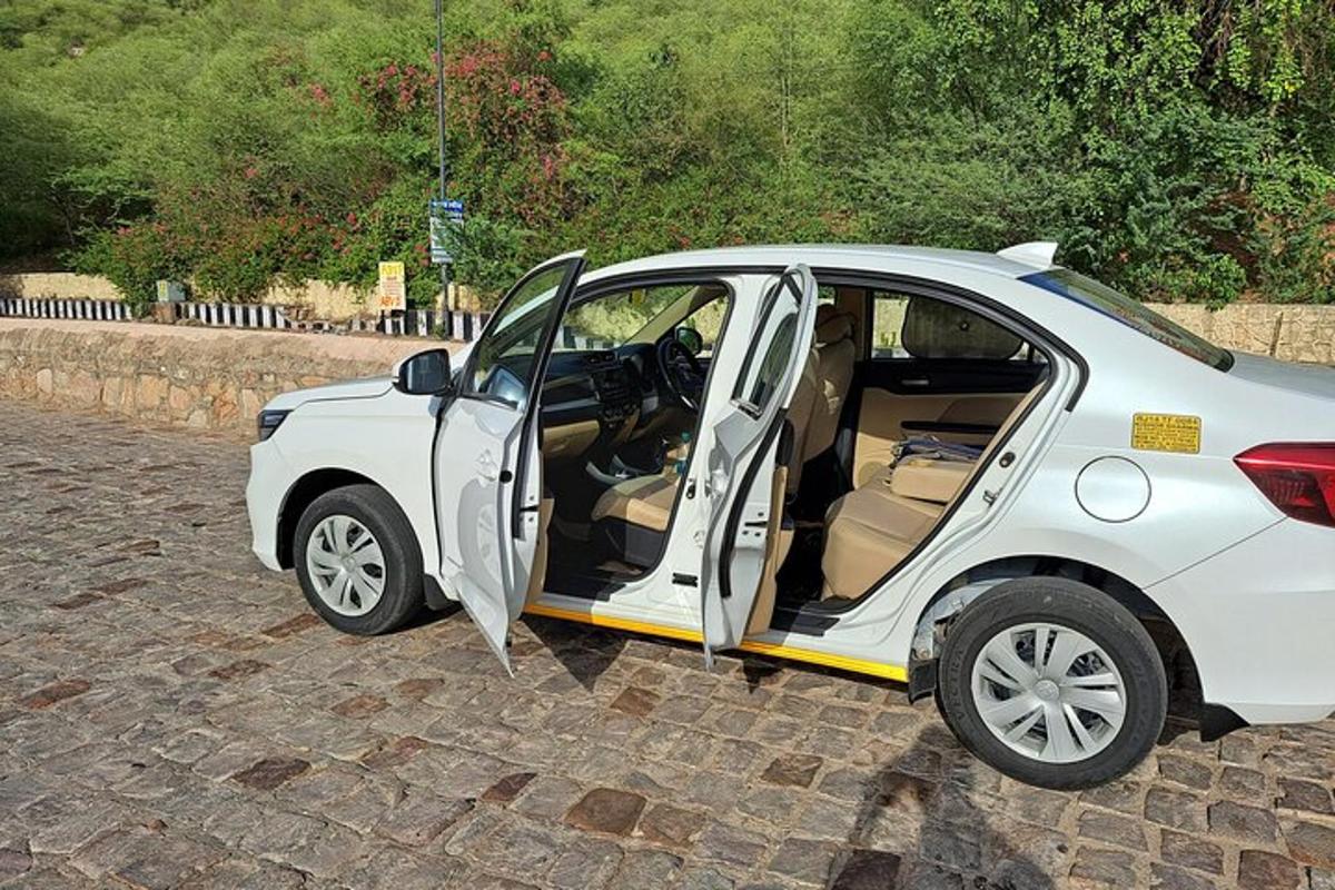 a small white car with its door open