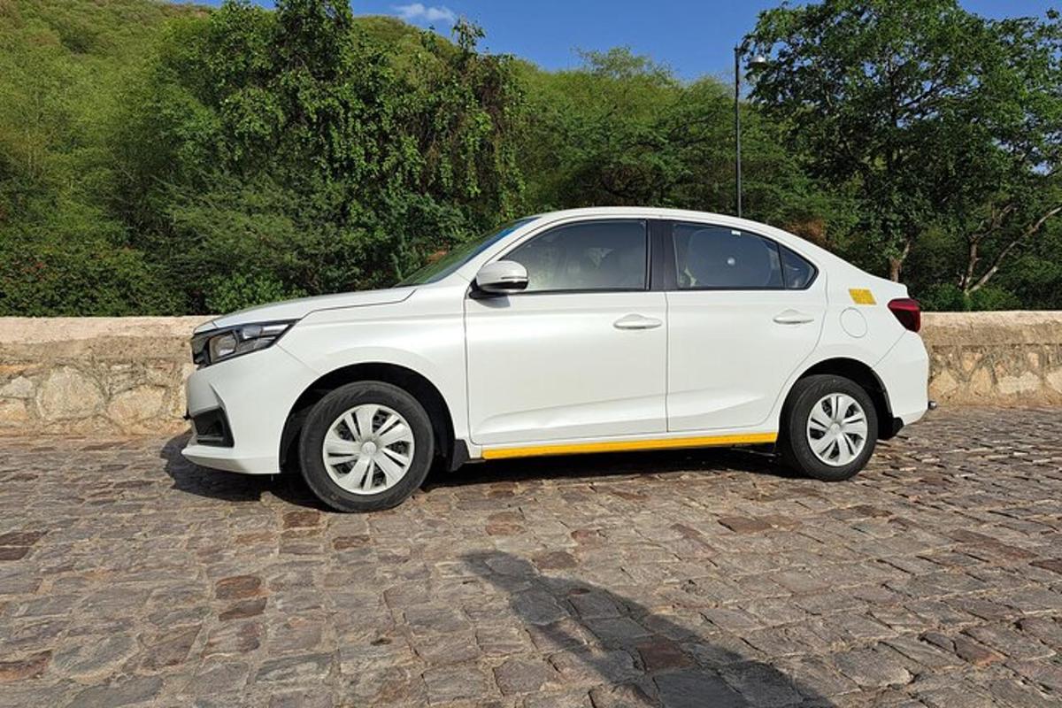 a white car parked on a brick road