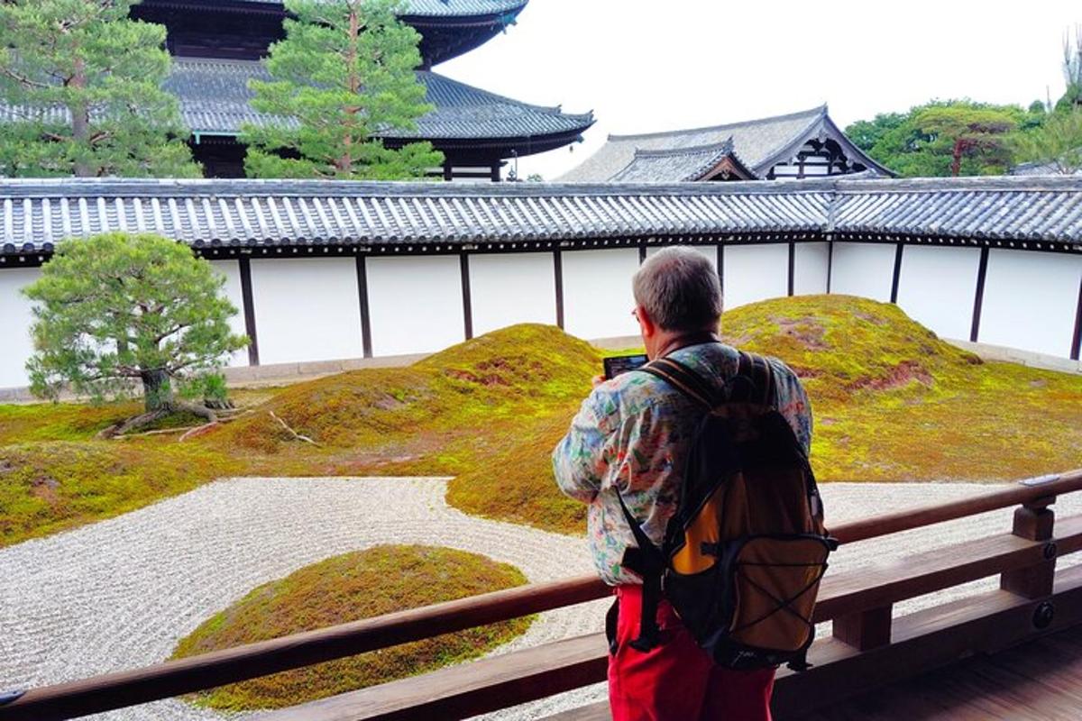 a man with a backpack looking at a temple