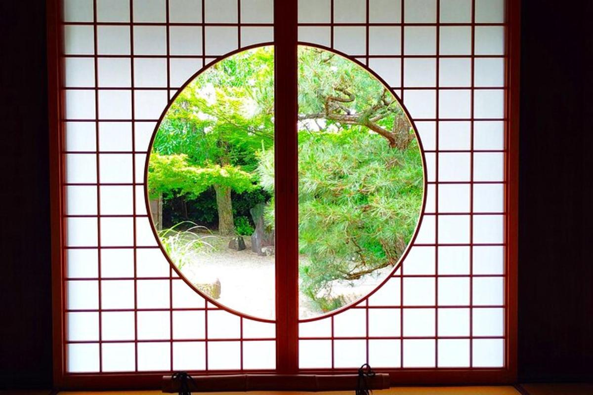 a glass window with a view of a tree