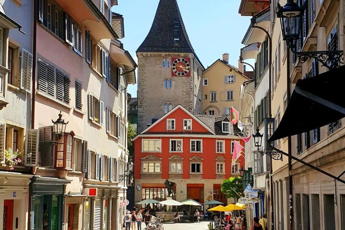 a city street with a clock tower in the distance
