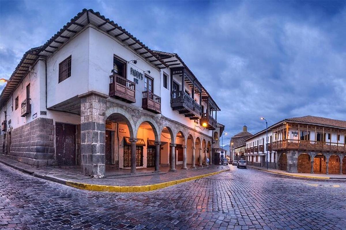 a cobblestone street in a town with buildings