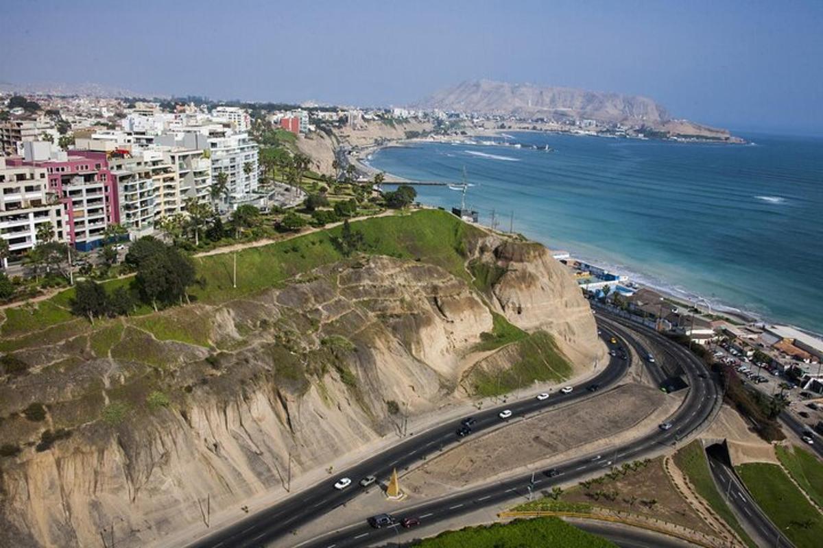an aerial view of a city and the ocean