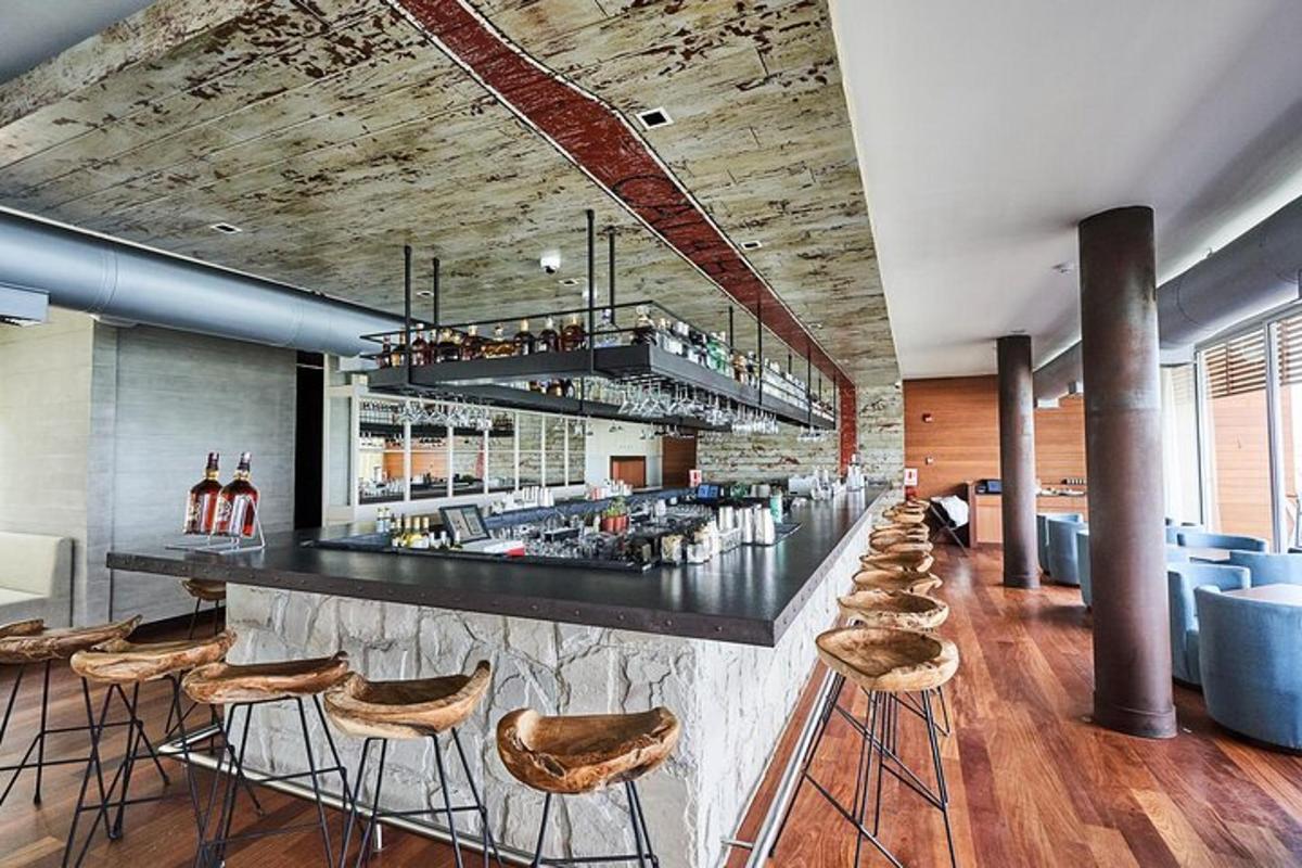 a bar with a row of stools in a restaurant