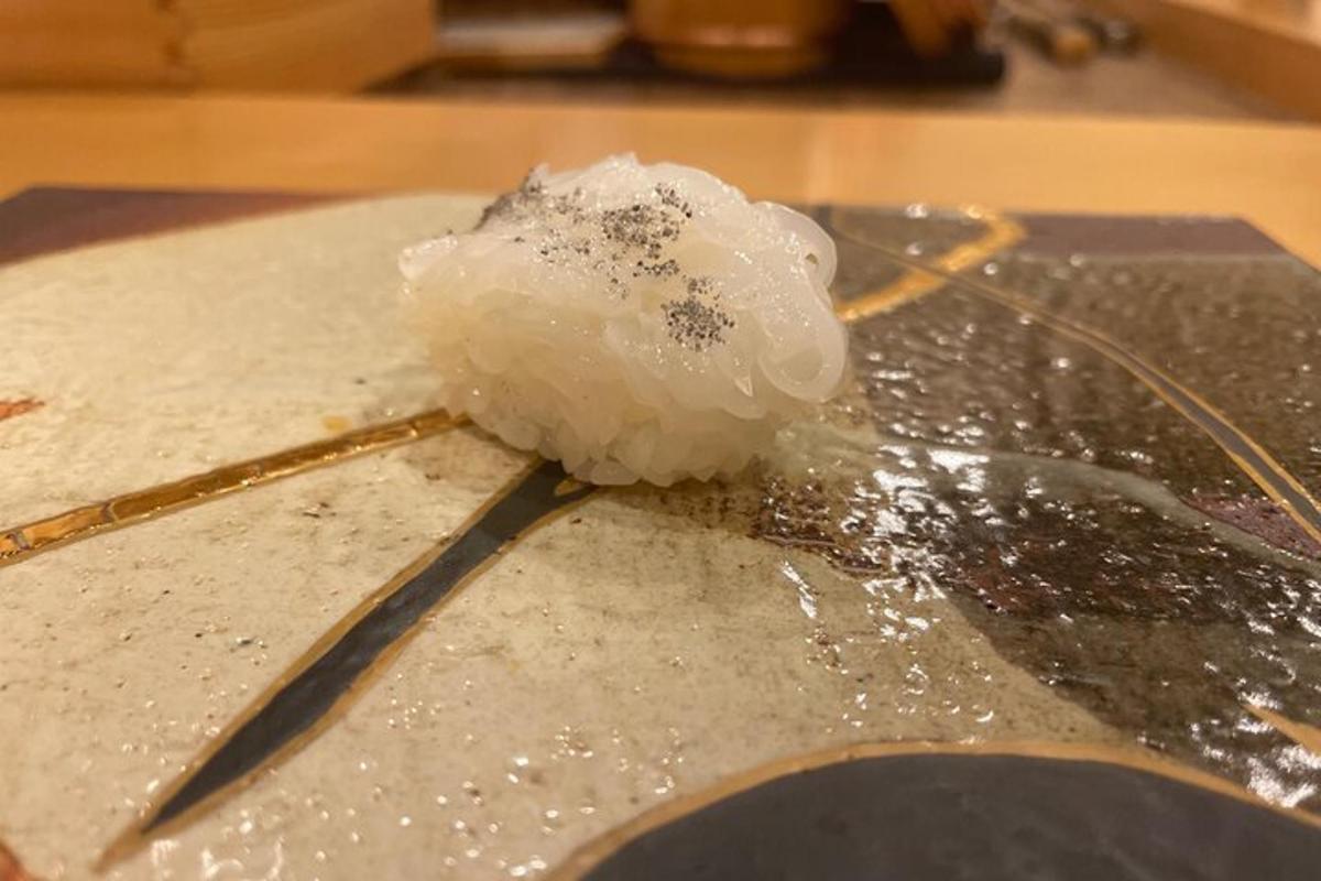 a piece of rice sitting on top of a table